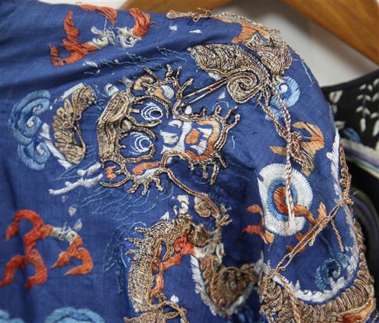 A Chinese embroidered silk and metal thread dragon robe, late 19th / early 20th century, faults
